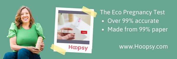 On a green background Lara Solomon is on the left holding a tube of Hoopsy pregnancy tests and on the right is what looks like a polaroid picture taped onto the background showing an image of someone holding the plastic free pregnancy test to the right of that are words in white stating that Hoopsy is eco-friendly and is made up 99% from paper.