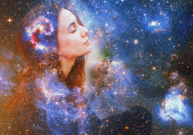 Image to represent the mind body connection. There is a lady on the left side on with her eyes closed looking relaxed. This image is over-layed with a depiction of the universe with swirls of light and stars.