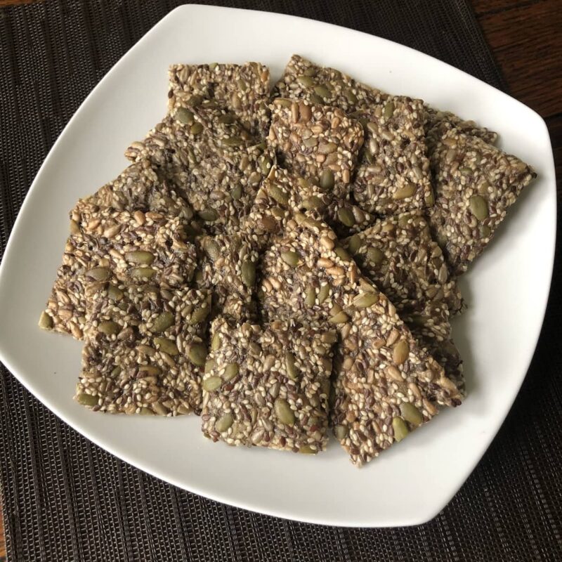 A photo of a place of these delicious gluten free seeded vegan crackers