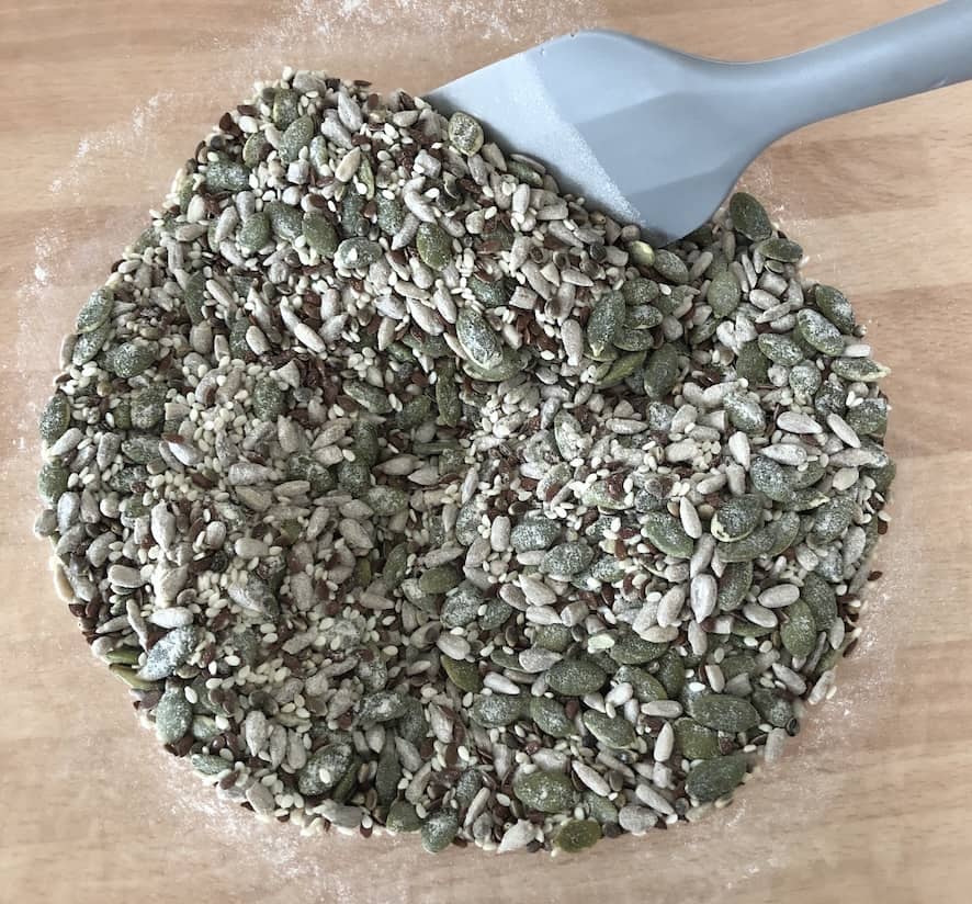 Bowl of all the mixed seeds and ingredients for these tasty glutne-free crackers
