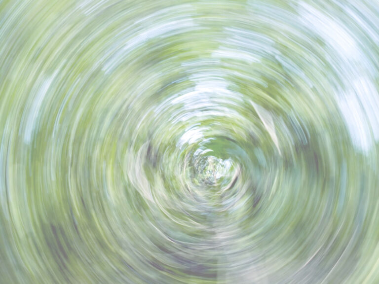 A switling pattern possibly light or water beyond is possible trees you can just make out it is green. It's to depict how you can't see the possibilities clearly when you are stressed.