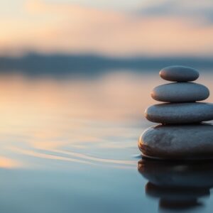 Pebbles stacked on top of each other in water to represent the emotional shifts during menopause