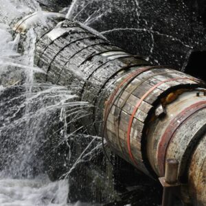 A row of barrels all fitted one next to the other in what looks like a river with a raging torrent or maybe a weir? Some of the barrels have holes and have sprung several leaks the water is spurting out from all angles. I've picked this image as we can sometimes that our bodies and health can fell like this.